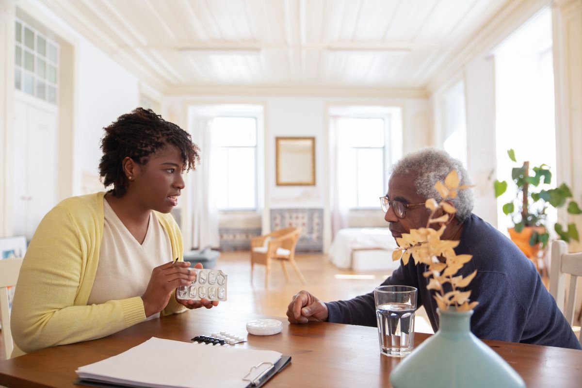 A care consultant speaking warmly with a client about home care options